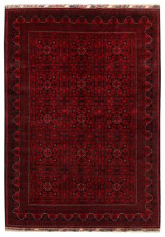 a red rug with an intricate design