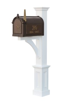 a mailbox mounted to the side of a white post