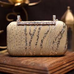 👛 Our Gold wedding clutch for bride is an elegant addition to your big day . This stunning gold sequin and thread embroidered clutch is ideal for any special occasion. The clutch bag is embellished with intricate embroidery. The clutch bag is closed with a designer snap. It is the ideal size for carrying your essentials like your phone, wallet, and keys. ✅ FEATURES: ⦿ Made using sequin embroidery. ⦿ Perfect accessory for any event ⦿ Adds a touch of luxury.  ⦿ Vibrant and eye-catching ✅ SPECIFIC Luxury Gold Embroidered Clutch For Festivals, Luxury Gold Embroidery Wedding Clutch, Gold Evening Bags With Handwork, Party Clutch With Pearl Embroidery In Gold, Gold Clutch With Pearl Embroidery For Party, Party Gold Clutch With Pearl Embroidery, Elegant Rectangular Sequin Clutch, Festive Gold Evening Clutch, Luxury Evening Bag With Pearl Embroidery For Parties