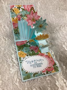 an open card with flowers on it