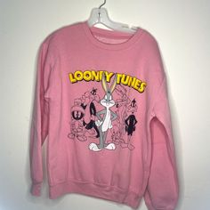 Pink Looney Tunes Medium New Without Tags Vintage Long Sleeve Tops With Cartoon Print, Relaxed Fit Crew Neck Top With Cartoon Print, Retro Long Sleeve Sweatshirt With Cartoon Print, Vintage Sweatshirt With Cartoon Print, Oversized Cartoon Print Crew Neck Top, Retro Long Sleeve Top With Funny Print, Graphic Print Crew Neck Sweater For Loungewear, Loungewear Graphic Print Crew Neck Sweater, Casual Tops With Cartoon Print For Loungewear