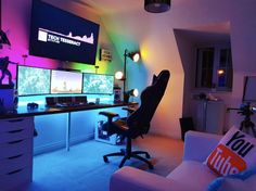 a living room filled with lots of computer monitors