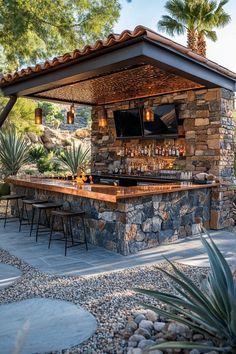 an outdoor bar with lots of bottles on it