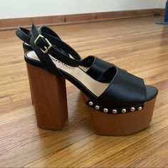 Nwt! Black Vegan Leather Sandals On Medium Brown Block Split Wood Platform Heels With Gold Studs And A Cool Retro Vibe! 5.25” Heel & 2.25” Platform Makes These Comfortable And Feel Like A 3” Heel. Perfect Pair To Transition From Summer To Fall And Pair With Everything From Jeans To A Maxi Skirt. Size 5.5, Fit True To Size/Like A 5.5-6. Trendy Party Sandals With Wooden Heel, Casual Party Wedge Sandals With Wooden Heel, Casual Sandals With Wooden Heel For Party, Open Toe Heels With Wooden Heel In Faux Leather, Blue Platform Shoes, Wood Platform Heels, Nude Platform Heels, White Platform Sandals, Velvet Pumps