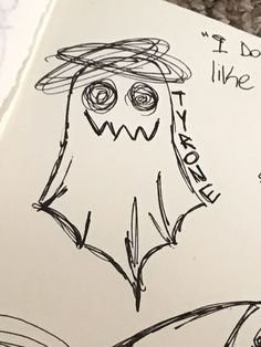 a drawing of a monster with words written on it and an image of a man's face