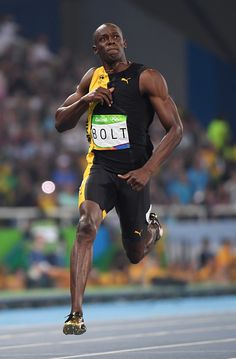 a man running on a track during a competition