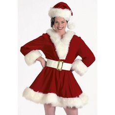 a woman dressed as santa clause posing for the camera