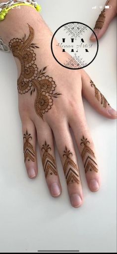 hendi tattoos on the palm of someone's hand