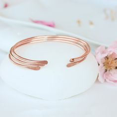 "These smooth rose gold cuffs are elegant and sleek. These stack beautifully with each other or your other jewelry - the perfect understated layering cuffs for your collection. Their round curve and high shine polish means that they are brilliant and light-catching. Plus, they're made from responsible/recycled rose gold fill.  These cuffs are made from 14K gold filled, which means they are safe to wear every day, even in the shower. Gold filled jewelry has a thick layer of 14K gold on top of a m Minimalist Stackable Rose Gold Bracelets, Minimalist Rose Gold Stackable Bracelets, Adjustable Rose Gold Minimalist Cuff Bracelet, Minimalist Stackable Rose Gold Bangle, Rose Gold Minimalist Bangle As Gift, Minimalist Rose Gold Stackable Bangle, Minimalist Rose Gold Bangle As A Gift, Stacking Bracelets, Bracelets Set