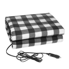 a black and white checkered blanket sitting on top of a charger plugged in