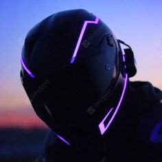 a person wearing a helmet with purple neon lights