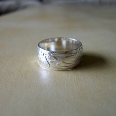 yes please Handmade Silver Wide Band Ring For Anniversary, Unique Silver Engraved Wide Band Ring, Silver Engraved Wide Band Ring For Gift, Handmade White Gold Wide Band Ring, Elegant Engraved Silver Wide Band Ring, Etched Sterling Silver Wide Band Jewelry, Silver Engraved Ring With Decorative Wide Band, Silver Engraved Wide Band Ring With Decorative Detail, Elegant Silver Engraved Wide Band Ring