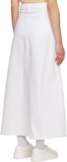 Paneled organic cotton denim skirt. · Belt loops · Five-pocket styling · Double button-fly for alternate styling · Flared hem · Logo patch at back Supplier color: Bright white Maxi Skirt Style, Paneled Skirt, Denim Maxi, Denim Maxi Skirt, Skirt Belt, White Paneling, White Maxi, Hem Style, Green Skirt