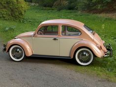 an old car is parked on the side of the road