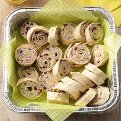 there are many rolls that have been cut up in the bowl and ready to be eaten