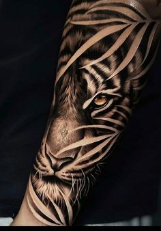 a man with a tiger tattoo on his arm