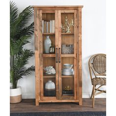 a wooden cabinet with glass doors and shelves