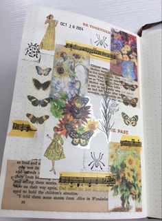 an open book with many pictures and words on the pages, including flowers and butterflies