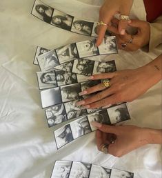 two hands pointing at pictures on a sheet of paper with the same person's finger