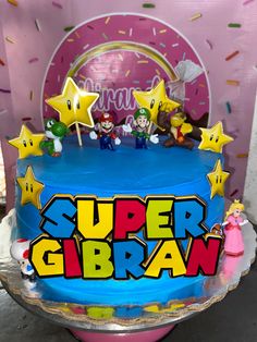 a birthday cake with the words super gibran on it and stars around it