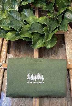 This embroidered stay grounded tree crewneck sweatshirt is a pre-shrunk, classic fit sweater that's made with air-jet spun yarn for a soft feel and reduced pilling. The mountain design is embroidered on a Gildan 18000 UNISEX Sweatshirt. This item ships within 2-7 days from the purchase date. See product images for sizing chart. ★Free Shipping★ Colors: Army Green Available in Plus Sizes (Up to 5X) SIZING ★ Sizing is unisex, so it runs like men's, though not overly large. ★ Most women find that th Travel Sweater, Trendy Sweatshirts, Mountain Design, Crewneck Vintage, Hiking National Parks, Stay Grounded, Mountain Designs