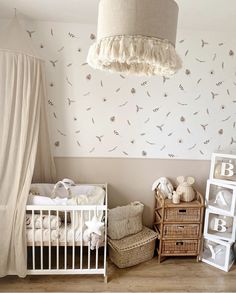 a baby's room is decorated in neutral colors