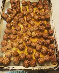 meatballs on a baking sheet ready to go into the oven