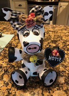 a cow figurine sitting on top of a counter