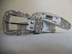 BB SIMON BELTS ITALIAN LEATHER MADE WITH AUTHENTIC SWAROVSKI CRYSTALS HANDMADE IN THE USA Our store has been carrying b.b. Simon belts for over 20 years to date and is the largest authorized retailer. If your belt is not in stock please allow 4-8 weeks for custom orders. Free 2 day shipping on all in-stock belts. Please pay attention to the shipping profile purchased. If we do not have your size we will automatically custom order your size on the belt and send a follow-up email to confirm your s Y2k Diamond Belt Boys, Bb Simon Belts, Bb Belt, Crystal Belt, White Studs, Concert Fits, White Belt, Womens Shoes High Heels, Womens High Heels