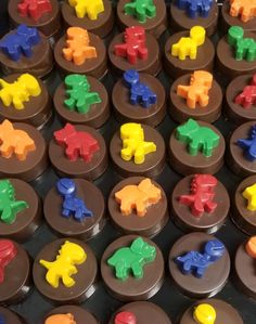 chocolates with different colored plastic elephants on them