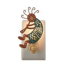 a light switch cover with a decorative design on it