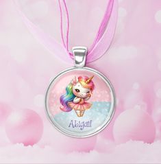 Unwrap the magic of the season with our delightful pendant necklace featuring a sweet little unicorn and personalized with her name! This necklace boasts a trio of layers; one soft chiffon ribbon and two pretty waxed cords in either pink or white: Pendant Necklace stats: * The length of the necklace is 16 inches, with an extra 2-inch chain link extender. * The necklace closure connection is a silver lobster claw and links. The necklace connection is Not a breakaway clasp, use caution. * Our ench Whimsical Charms Necklace For Birthday, Whimsical Charms Necklace For Birthdays, Whimsical Personalized Necklaces For Gifts, Whimsical Personalized Necklace For Birthday Gift, Whimsical Personalized Jewelry For Birthday, Whimsical Personalized Jewelry For Birthdays, Cute Adjustable Nickel-free Necklace, Cute Adjustable Nickel-free Necklaces, Adjustable Charms Necklace For Birthday