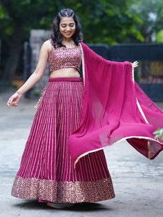 This gorgeous set includes a magenta color georgette material lehenga with zari embroidered work and sequin work, a similar color georgette material choli with sequin work, and a matching georgette dupatta. The lehenga is semi-stitched up to 42 inches, allowing for a customizable fit, while the choli material is unstitched, giving you the freedom to tailor it to your liking.
Elegance and style, but it is also versatile and suitable for weddings, receptions, cocktail parties, and other ethnic gat Sequin Georgette Lehenga For Reception, Sequin Georgette Lehenga In Traditional Drape, Sequined Georgette Lehenga With Traditional Drape, Traditional Drape Georgette Lehenga With Sequins, Diwali Georgette Choli With Sequins, Traditional Drape Sequined Georgette Lehenga, Eid Sequined Georgette Choli, Diwali Sequin Georgette Choli, Eid Sequin Georgette Choli