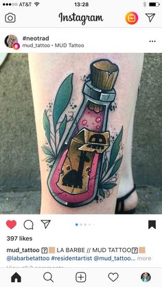 a tattoo on the leg of a woman with an image of a bottle in it