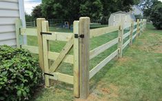 a wooden fence in front of a house