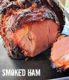 a close up of meat on a plate with the words smoked ham in front of it