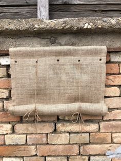 a burlock hanging on the side of a brick wall