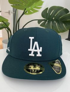 • Green fitted hat • Grey undervisor • New Era 59Fifty • Low-profile silhouette • Embroidered Dodgers logo at center-front • Embroidered Aimé Leon Dore logo on side panel • 100% Polyester • Made in China New Era size guide below Runs large. Recommend sizing down for your usual fit. SIZE 7 7⅛ 7¼ 7⅜ 7½ 7⅝ 7¾ 7⅞ CIRC (IN) 22 22⅜ 22¾ 23⅛ 23½ 23⅞ 24¼ 24⅝ CIRC (CM) 55.8 56.8 57.7 58.7 59.6 60.6 61.5 62.5 Six-panel Hats With Embroidered Logo For Streetwear, Green Fitted Hat For Baseball Season, Casual Baseball Cap With Appliqué Logo, Urban Fitted Hat With Embroidered Logo And Curved Brim, Urban Hats With Embroidered Logo And Curved Brim, Logo Baseball Cap For Baseball Season, Curved Brim Fitted Hat With Logo Patch, Green Baseball Cap With Logo Patch And Curved Brim, Green Six-panel Snapback Hat For Sports Events