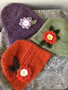 Beautiful hand crocheted ladies' bucket hats in various colors and styles embellished with fun and whimsical flowers.  These ladies hats are average adult size.  The purple one and the orange one are somewhat heavier and particularly warm! Crochet Bucket Hat, Matching Baby, Baby Hats, Hand Crochet, Hats For Women, Bucket Hat, Caps Hats, Accessories Hats, Two By Two