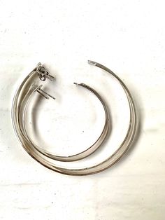 "Large Sterling Silver Hoops , Large Hammered Hoop Earrings Simple and stunning stud hoop earrings. They are lightweight and comfortable. They're the perfect classic Hoop! 3 sizes are now available - select from the drop down menu. Square wire is used and hammered down for a square effect. XL Hoops are 70mm/ 2 & 3/4\" in diameter. L Hoops / Diameter of the large Hoops is between 55-60mm. Small Hoops/ And diameter of small Hoops is around 45mm. Handmade in Australia free Shipping in Australia Modern Adjustable Hoop Wrap Earrings, Adjustable Modern Hoop Wrap Earrings, Hammered Hoop Earrings, Hammered Sterling Silver, Earrings Simple, Sterling Silver Hoop Earrings, Sterling Silver Hoops, Simple Earrings, Everyday Jewelry