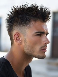 Ideal for men short on time but big on stylethe Sharp Fade Faux Hawk features tightly shaved sides with a dramaticspiky crest that stands out in any crowdIt’s a great fit for formal events or a night outThis faux hawk works best on angular faces and is particularly complementary for those with dark eyes. Spiky Fade Haircut Men, Mens Spiky Haircut, Fade Faux Hawk, Curly High Top Fade, Head Construction, Hairstyles Mens, Round Face Men