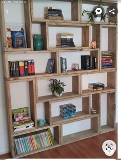 the bookshelf is made out of wooden pallets