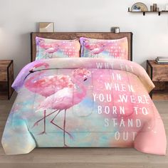 a bed with pink flamingos on it and the words when you were born to stand out