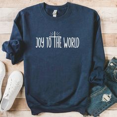 "Celebrate the Christmas season with the cute \"Joy To The World\" Christian sweatshirt made by Gildan. Gildan 18000 Sweatshirt - size up 1 or 2 sizes for an oversized look.   Available in many colors: please refer to pictures Ideal for any situation, a unisex heavy blend crewneck sweatshirt is pure comfort. These garments are made from polyester and cotton. This combination helps designs come out looking fresh and beautiful. The collar is ribbed knit, so it retains its shape even after washing. Christian Christmas Sweatshirt, Christmas Christian Shirts, Christian Christmas Shirt Ideas, Cricut Sweaters, Christmas Sweatshirt Ideas, Christian Sweater, Christmas Graphic Tees, Jesus Christmas Shirt, Cowgirl Closet