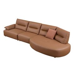 a brown leather sectional sofa with two pillows on the back and one arm facing outward