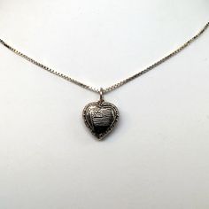 "This antiqued sterling silver, two-sided, repousse Puffy heart Charm Number 33 features an American flag framed by an heart. Marked, Sterling. Made by Brown County Silver. Vintage and in new, never worn condition. Approximately 30 years old. Small: 5/8\" high with jump ring 3/8\" wide 0.7 grams Medium: 7/8\" high with jump ring 5/8\" wide 1.4 grams *Chain sold separately See more @ https://www.etsy.com/shop/brocosi" Engraved Double Heart Necklace For Memorial, Etched Silver Jewelry For Mother's Day, Memorial Double Heart Engraved Necklace, Silver Etched Necklace For Valentine's Day, Valentine's Day Silver Etched Necklace, Vintage Sterling Silver Heart Necklace Nickel Free, Etched Heart Silver Necklace, Silver Heart-shaped Etched Necklace, Etched Heart Silver Jewelry