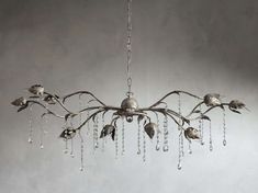 a chandelier hanging from a ceiling with birds on it