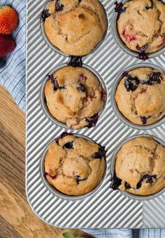 a muffin tin filled with blueberry muffins