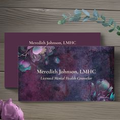 the front and back of a business card with flowers on it, next to a pink flower