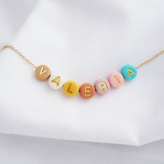 Dainty Colorful Name Necklace Alphabet Initial Necklace Custom Gift for Her Fun Summer Necklace Women Necklace Jewelry Birthday Gift Customize your necklace the way you want, add a name, motivational word, initials etc. Perfect for bridesmaids, sister, mother and daughter gifts, travel gifts, soul mates jewelry gifts etc. Made with high quality stainless steel plated chains. If you select two words, will be separated by a bead. Beads are 6mm, will be selected randomly, unless you let us know an specific initial color or colors. We offer rose gold, gold or rhodium color. P A C K A G I N G All jewelry comes in a velvet pouch. NOTE We don't recommend beaded necklaces for children under 3 years old without adult supervision as it contains small parts that can be swallowed. Beaded Name Necklace, Whimsical Accessories, Mother Daughter Necklace, Beads Ideas, Soul Mates, Daughter Jewelry, Necklace Initial, Daughter Necklace, Necklace Craft